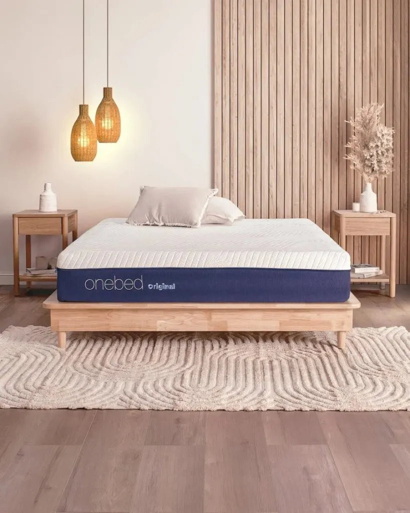 Onebed Original 11 inch mattress with its cover partly unzipped to show the flippable layers