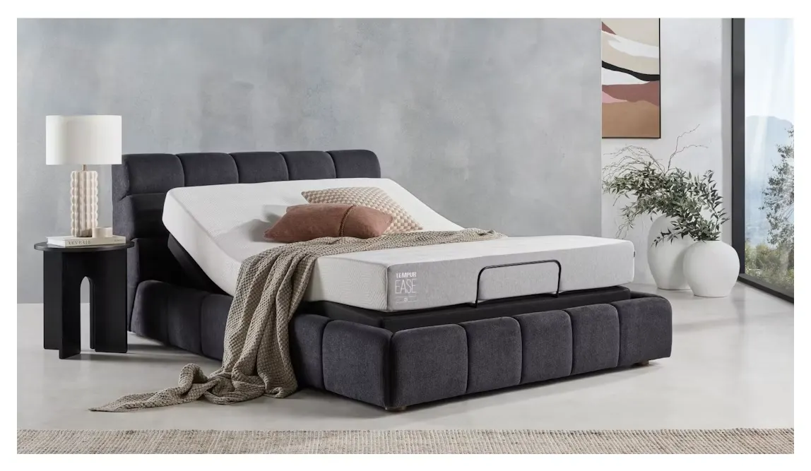 The TEMPUR Ease 20 on an adjustable bed base with the head section raised.